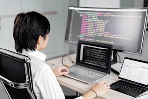 A person working at their computer in an office.