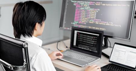 A person working at their computer in an office.