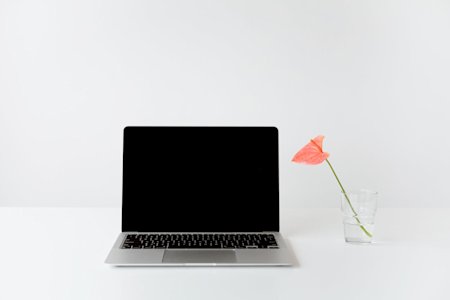 A laptop on a desk.