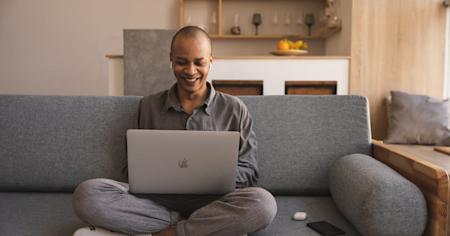 A man at home using Splashtop on his laptop to work securely from home.