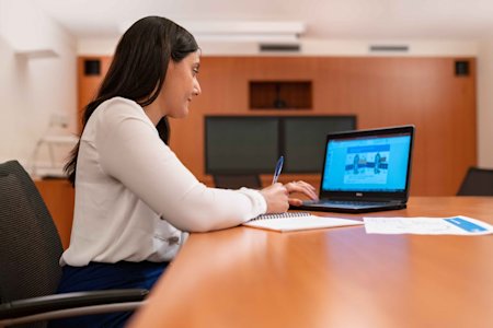 A businesswoman using her PC laptop.