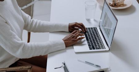 Person using a laptop and researching Splashtop Business Access, listed among top 5 remote desktop features online