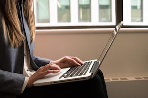 A person using a laptop computer.