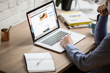 A remote worker is sharing his screen with his coworkers.
