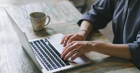 A person typing on a laptop.