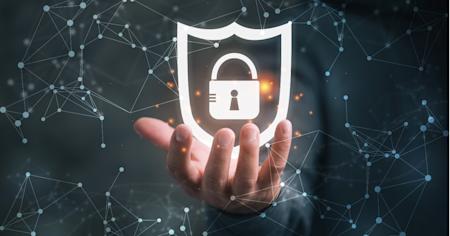 Hand holding cybersecurity lock and shield icon