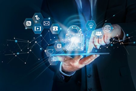 A man holding a tablet with a network icons floating above it.