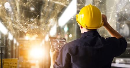 A construction worker on an IoT tablet.