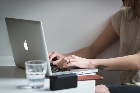 A person using a laptop computer.