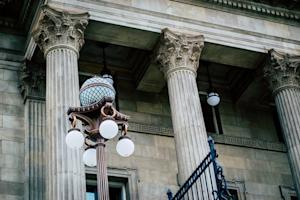 Elegant historical building and ornate street lamps