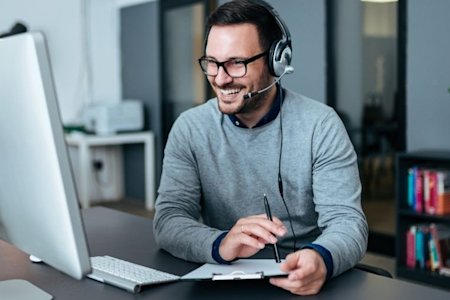 IT analyst engrossed in reading about different remote desktop solutions