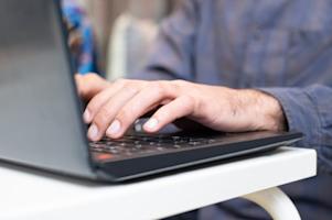 A person typing on a computer.
