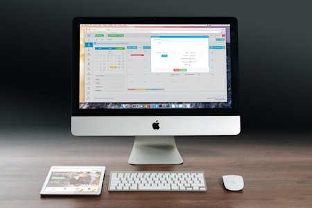 A Mac desktop computer on a desk.