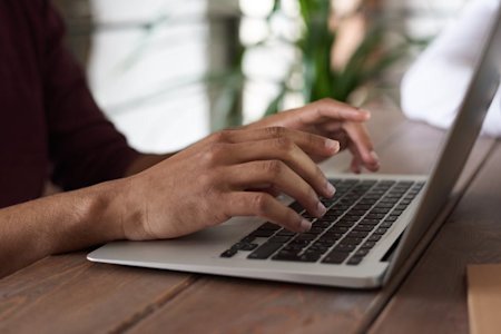 A person typing on a computer.