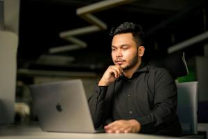 A person working on his laptop.