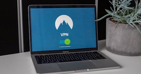 A laptop sitting on a desk displaying a VPN screen