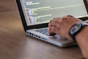 A developer using remote desktop software for coding.