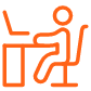 Student sitting at desk icon