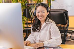 An IT support agent working at their computer.