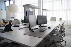 Desktop computers in an office.