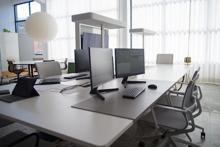 Desktop computers in an office.