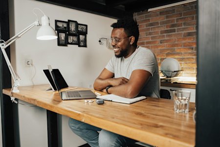 A small business owner working on his laptop.