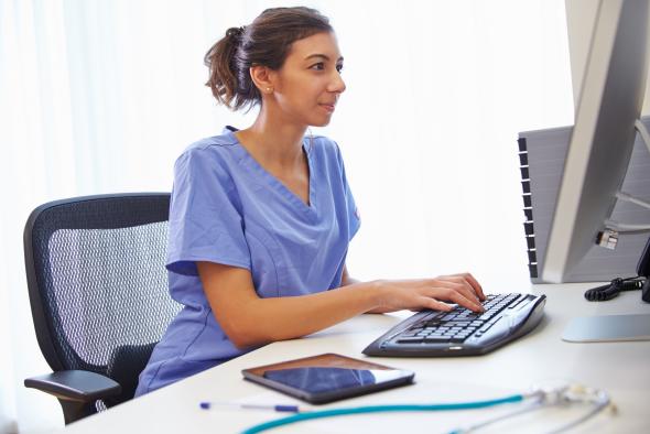 A nurse using Splashtop's remote access software to look at a patient's records.