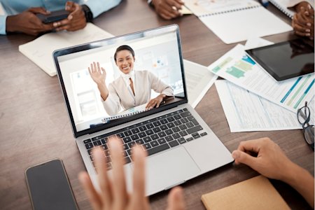An employee joining a remote sales training session from his laptop using Splashtop's remote access software.