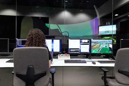 A person working on a computer at a desk.