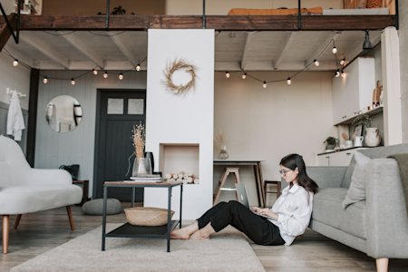 A woman working from here home using a laptop.