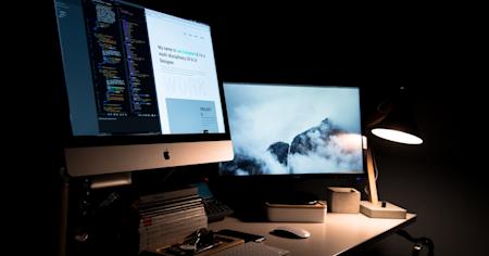 A desktop computer and monitor sitting on a desk.