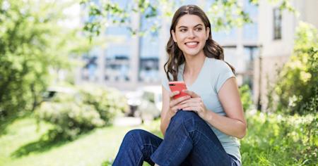 Female outdoors enjoying Splashtop Classroom with mobile phone