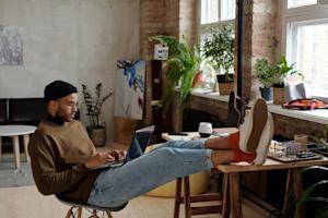 A man working remotely from his home.