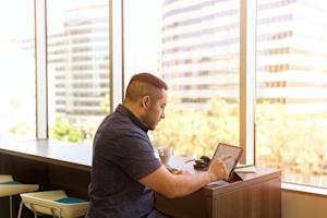 A man using a tablet to work.