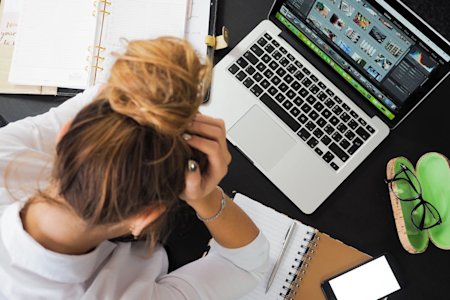 A person working on a laptop.