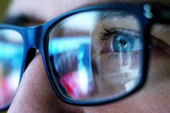 Close up of a person's glasses as they use a computer with Splashtop, the better alternative to LogMeIn