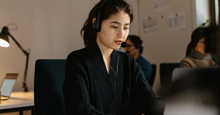 An IT tech support worker at their desk.