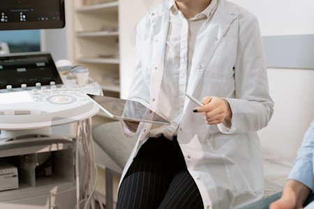 A doctor using remote access software to access patient data from her tablet.