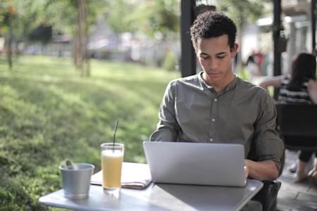 A man using a laptop with Splashtop to replace TeamViewer