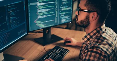Man using Splashtop remote desktop application on his laptop to access a Linux machine while working