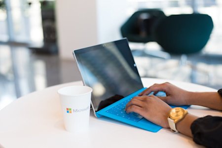 A person typing on a laptop.