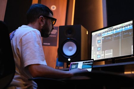 A man working remotely using Splashtop on an audio production project