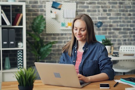 A woman using her laptop.