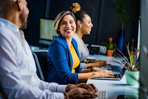 Happy computer users in an office