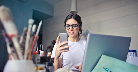 A woman receiving a two-factor authentication code on her phone while logging into Splashtop remote access software