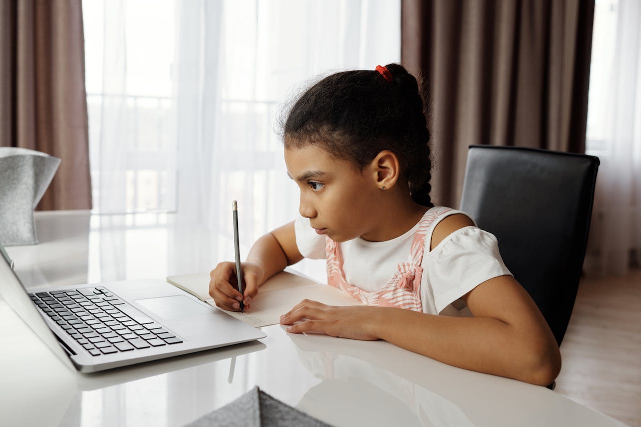 A student on her laptop at home leveraging Foxpass to connect to the school's network.
