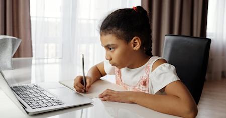 A student on her laptop at home leveraging Foxpass to connect to the school's network.