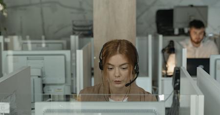 An IT support agent at their workstation.