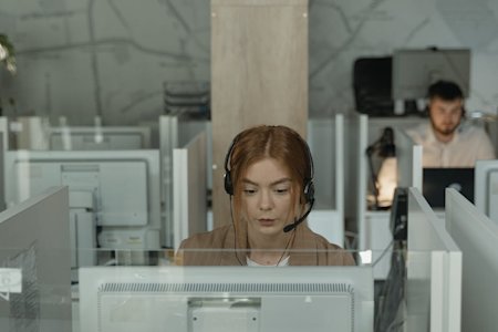 An IT support agent at their workstation.