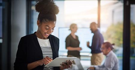 Four busy employees using Splashtop's remote access software to be more productive.